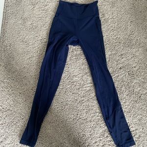 Navy blue sheer detail side pocket Lululemon high waisted leggings